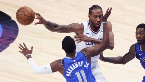 Jun 4, 2021; Dallas, Texas, USA; LA Clippers forward Kawhi Leonard (2) passes past Dallas Mavericks forward Tim Hardaway Jr. (11) during the third quarter during game six in the first round of the 2021 NBA Playoffs at American Airlines Center. Mandatory Credit: Kevin Jairaj-USA TODAY Sports